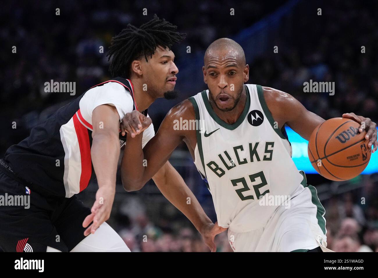 Milwaukee Bucks' Khris Middleton tries to get past Portland Trail ...
