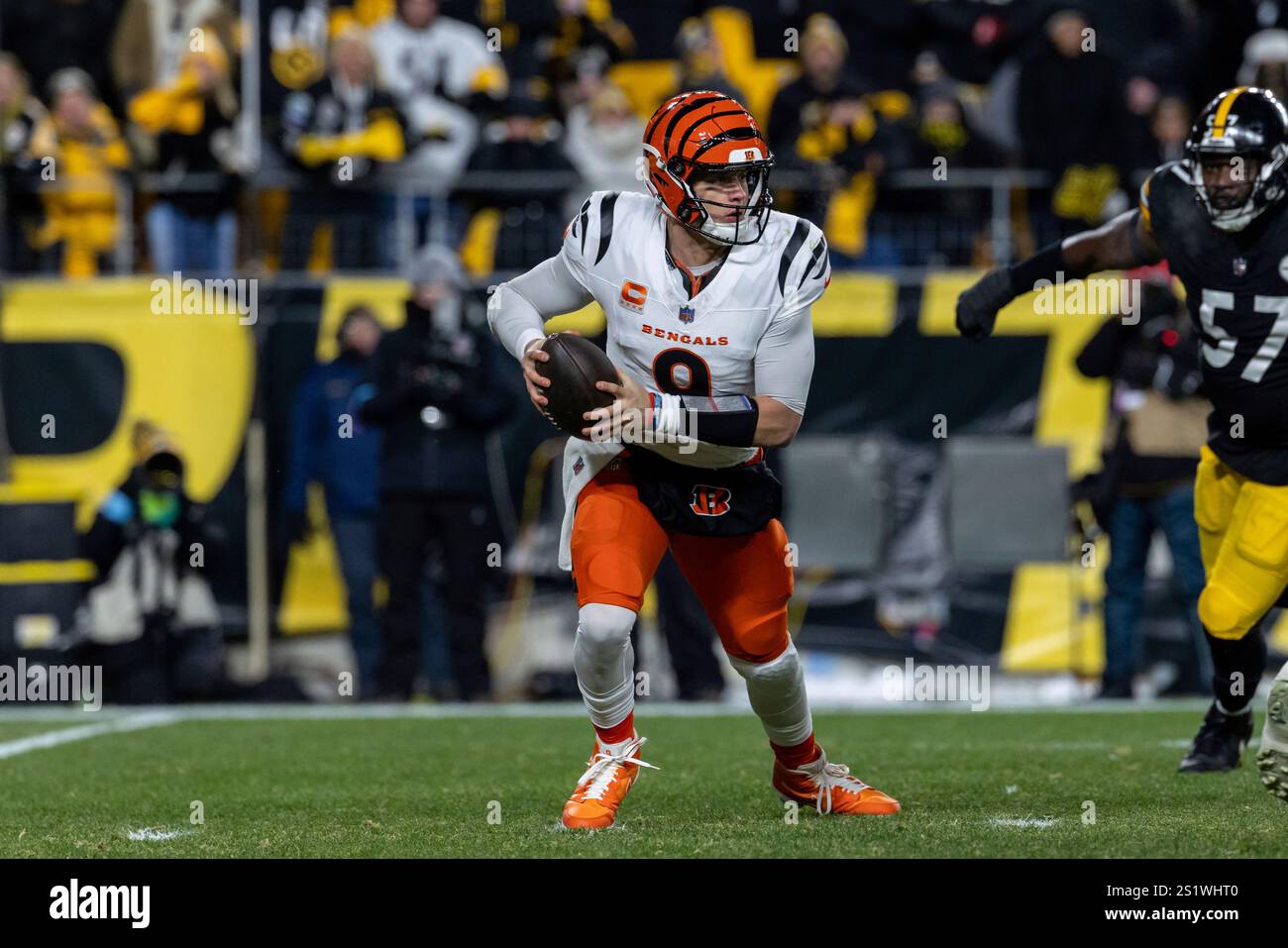 Cincinnati Bengals quarterback Joe Burrow (9) scrambles during an NFL