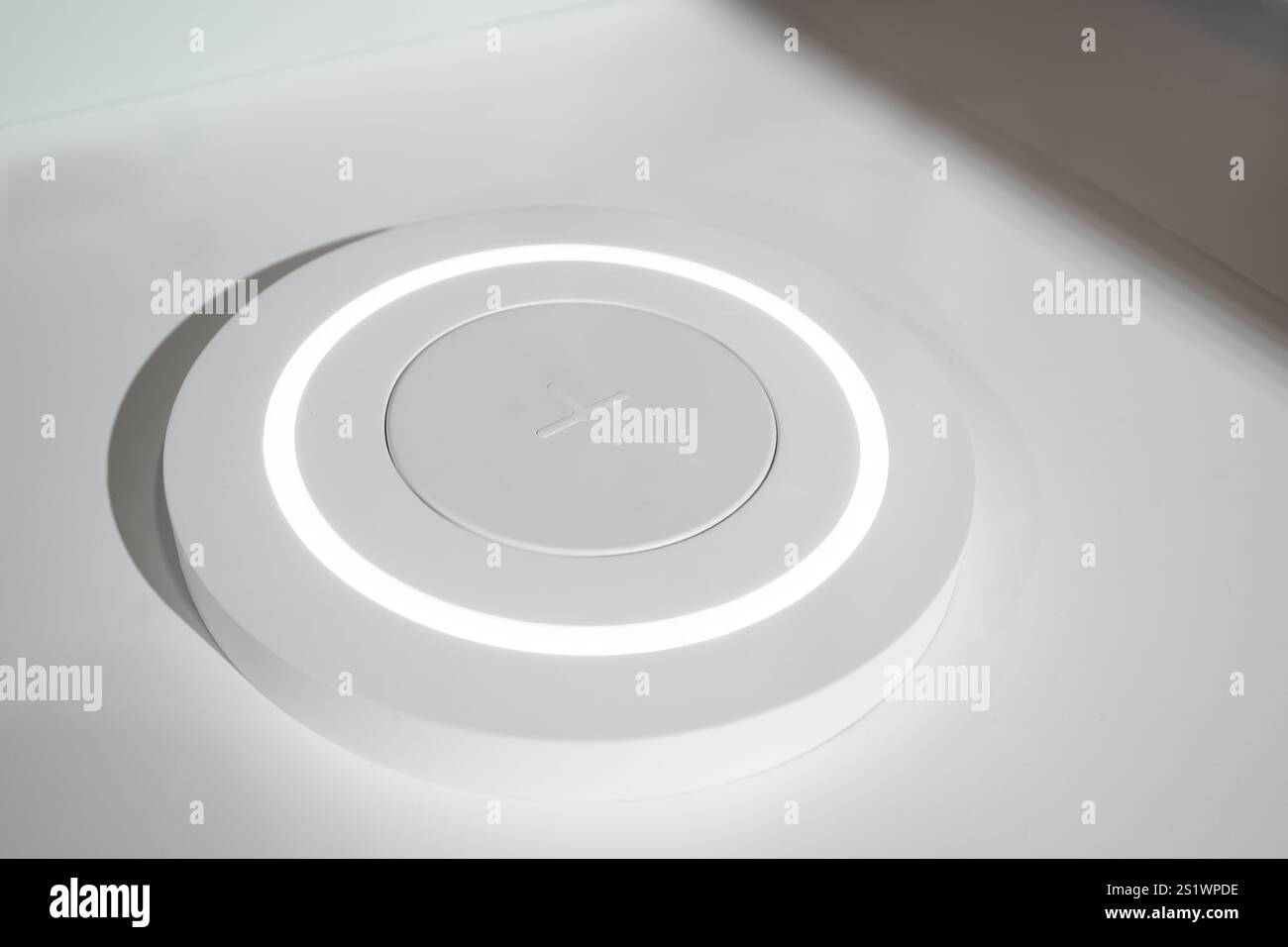 Wireless charging station on the table Stock Photo