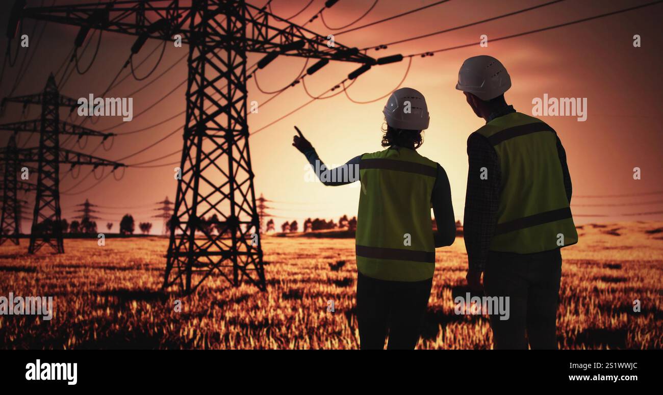 Electrician Workers Talking Near High Voltage Circuit Line Tower Stock Photo