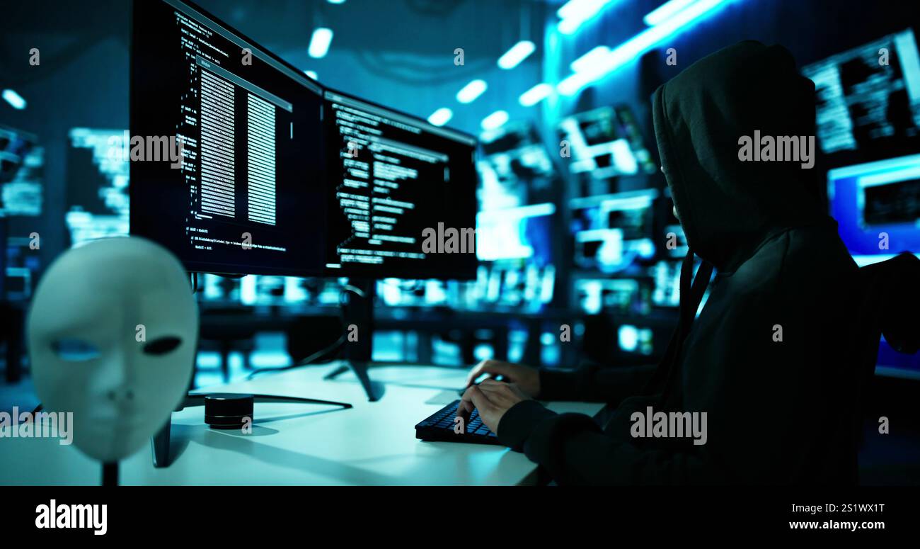 Hacker Stealing Data From Computer. Piracy And Fraud Stock Photo