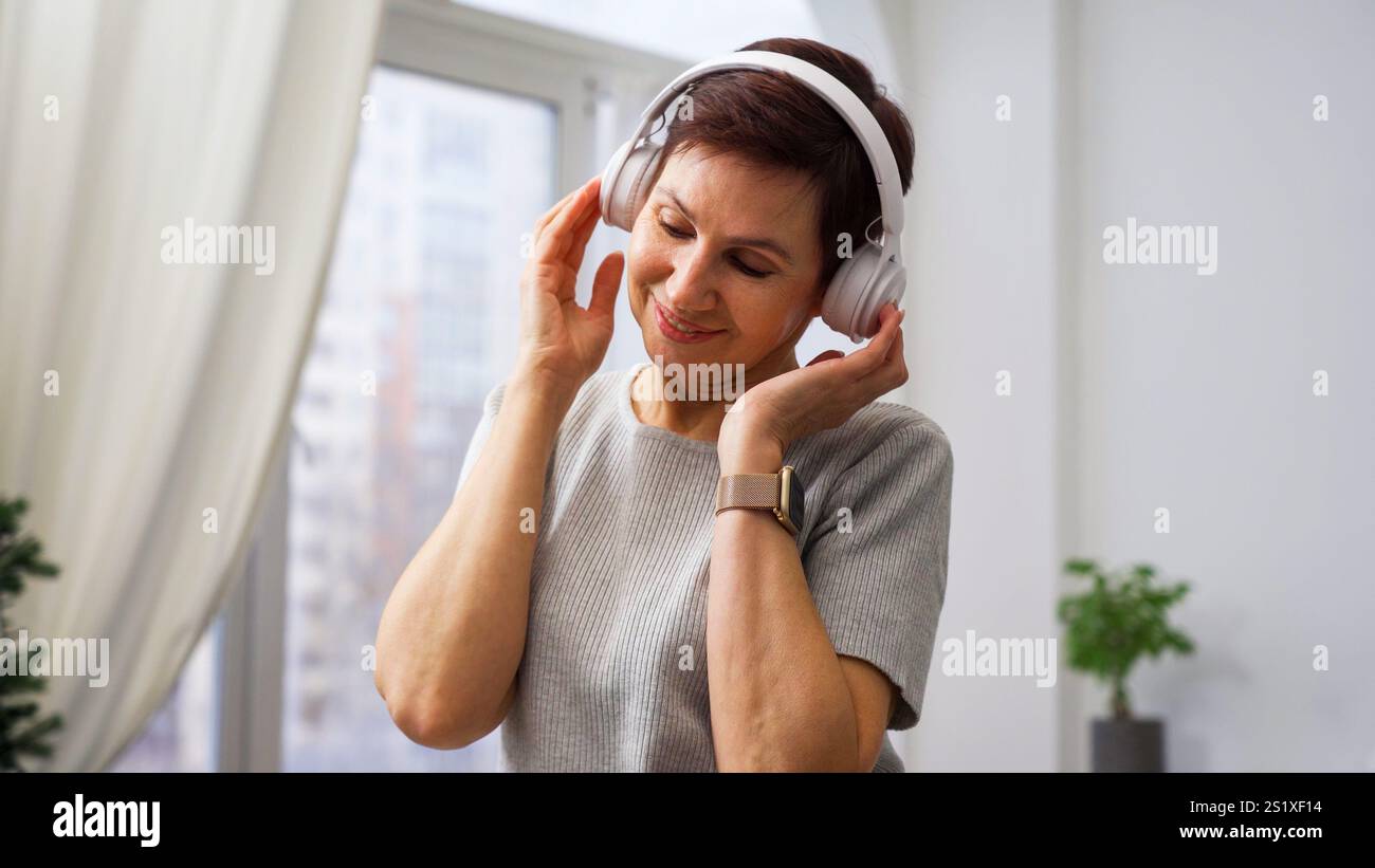 Woman enjoying music in headphones Stock Photo
