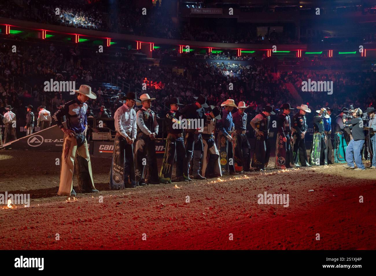 New York, United States. 04th Jan, 2025. Bull riders stand on the field ...