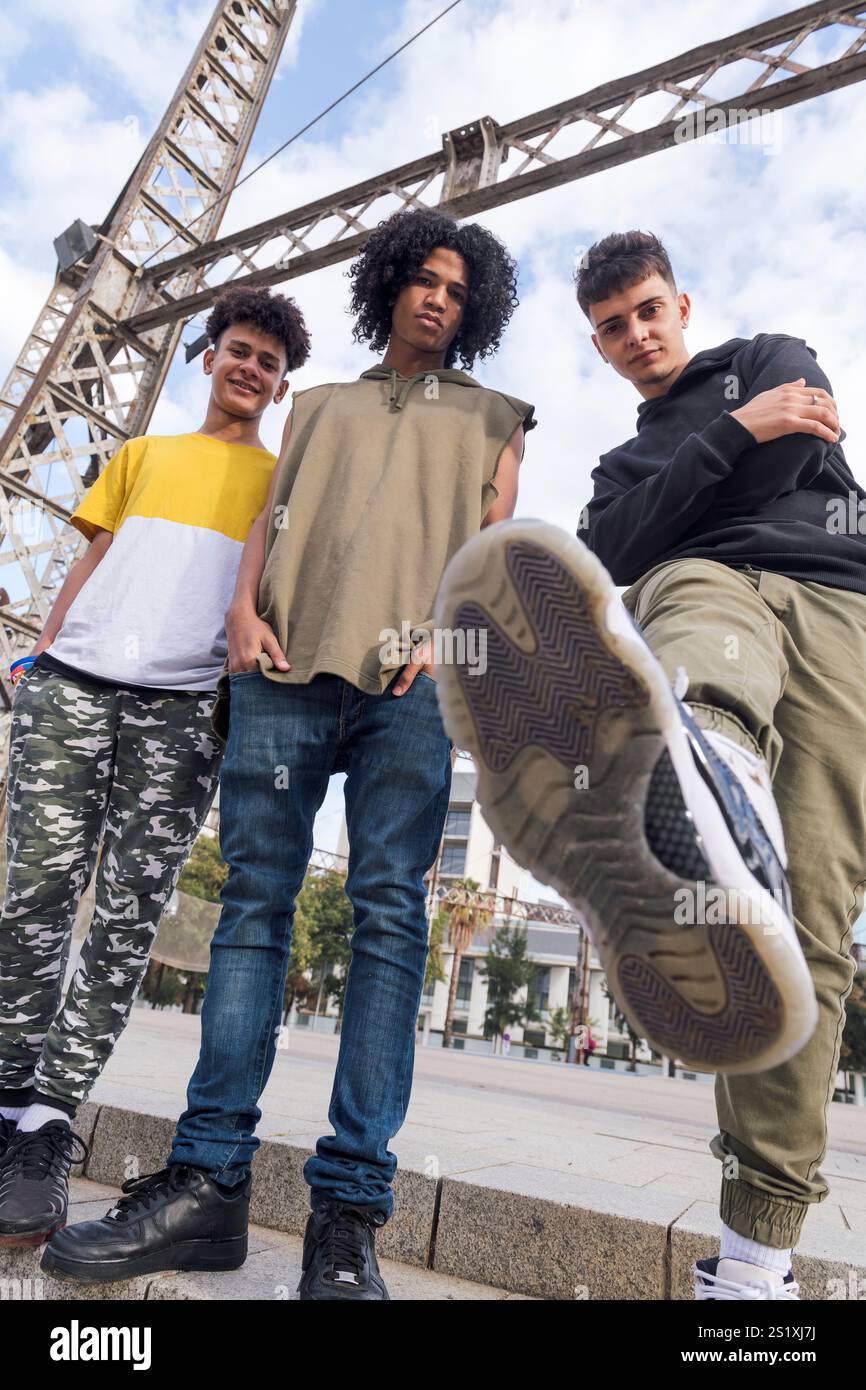 three teenagers looking at camera challenging Stock Photo
