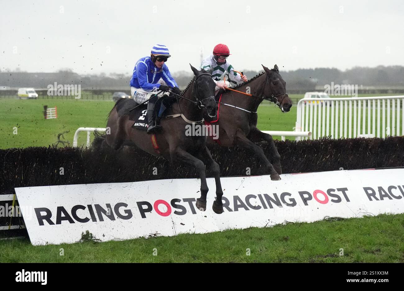 Ile Atlantique ridden by jockey Paul Townend (left) clear the last fence on their way to winning the Racing Post Novice Chase at Naas Racecourse in County Kildare, Ireland. Picture date: Sunday January 5, 2024. Stock Photo