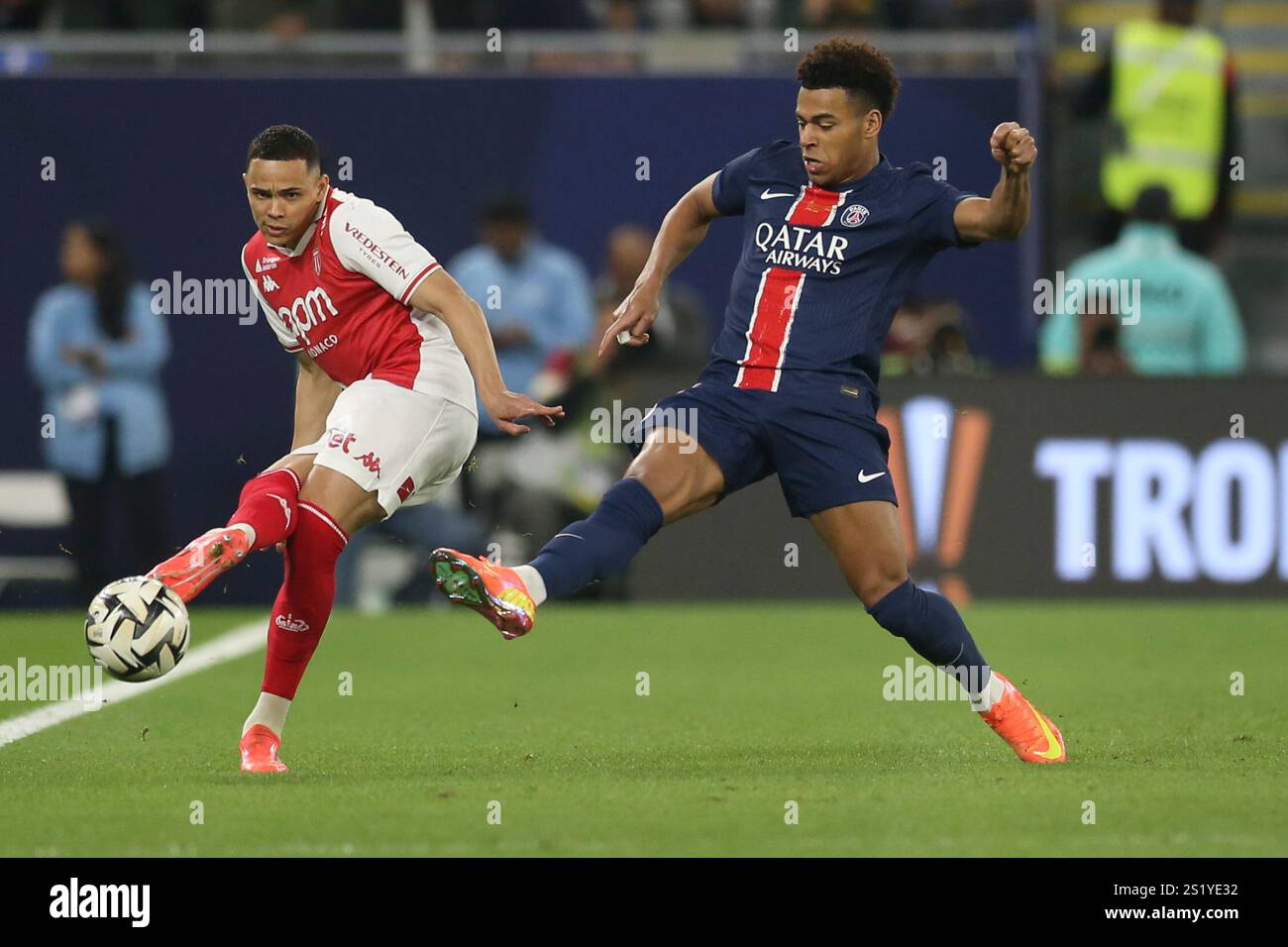 Monaco's Vanderson passes the ball by PSG's Desire Doue during the