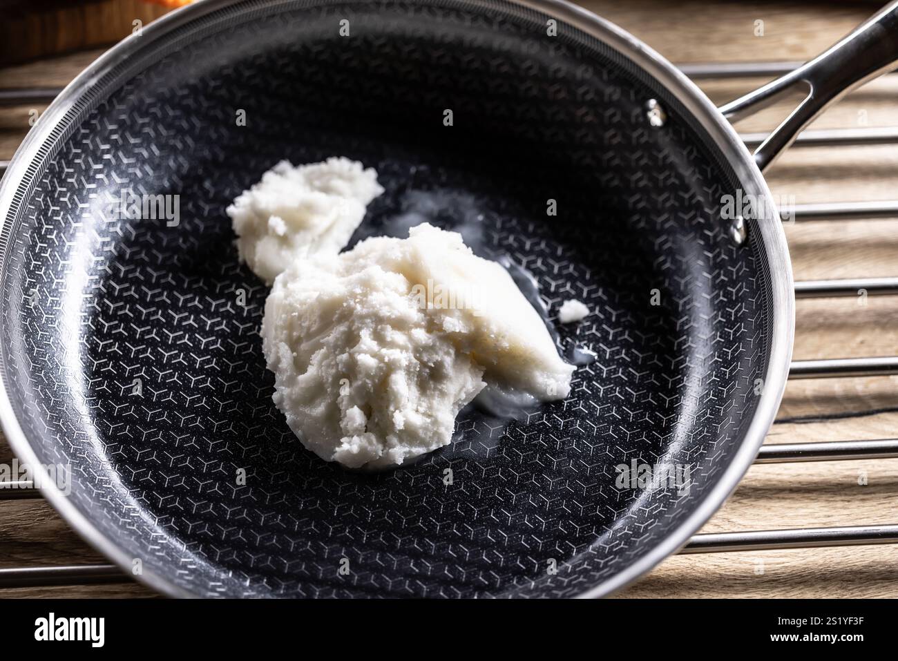 Pork lard in a non-stick cast iron pan. Stock Photo