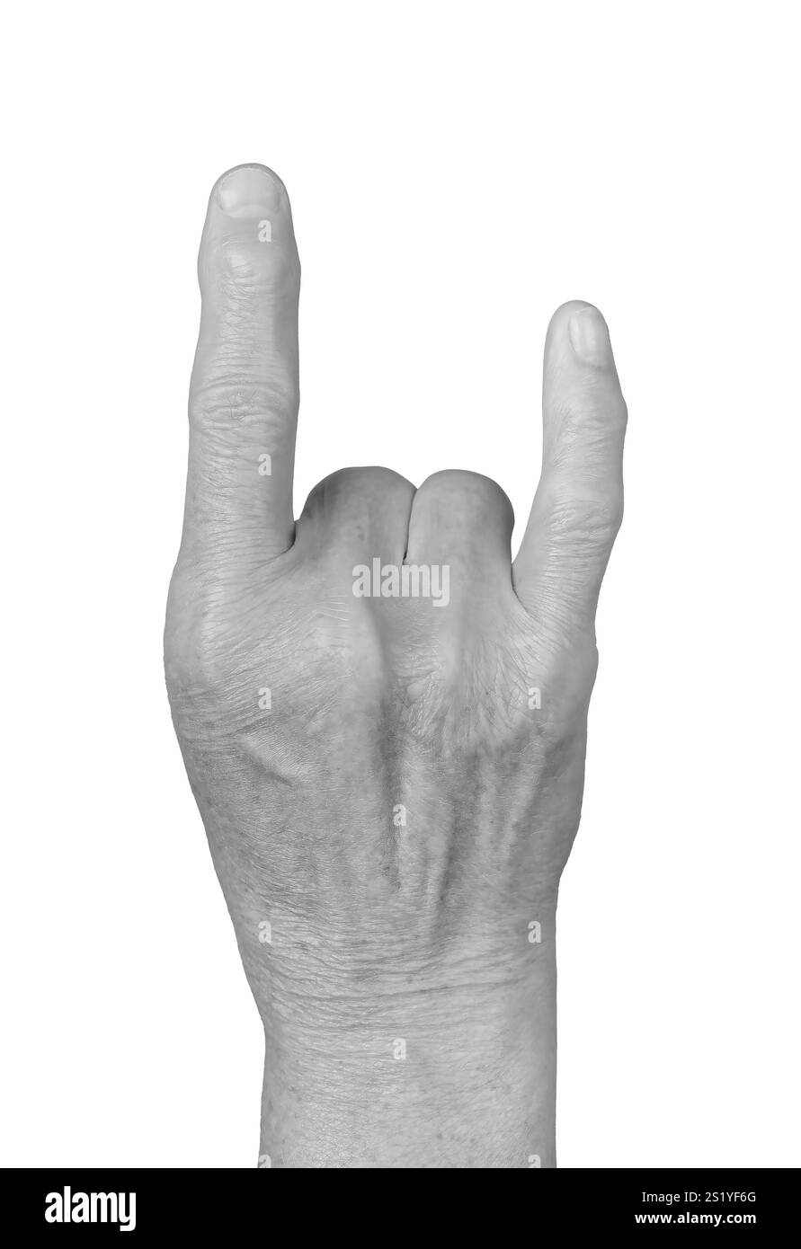 Rock hand gesture. Senior woman s wrinkled hand with fingers forming ...
