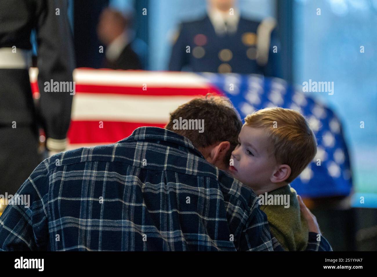 Mourners view the casket of former President Jimmy Carter as he lies in ...