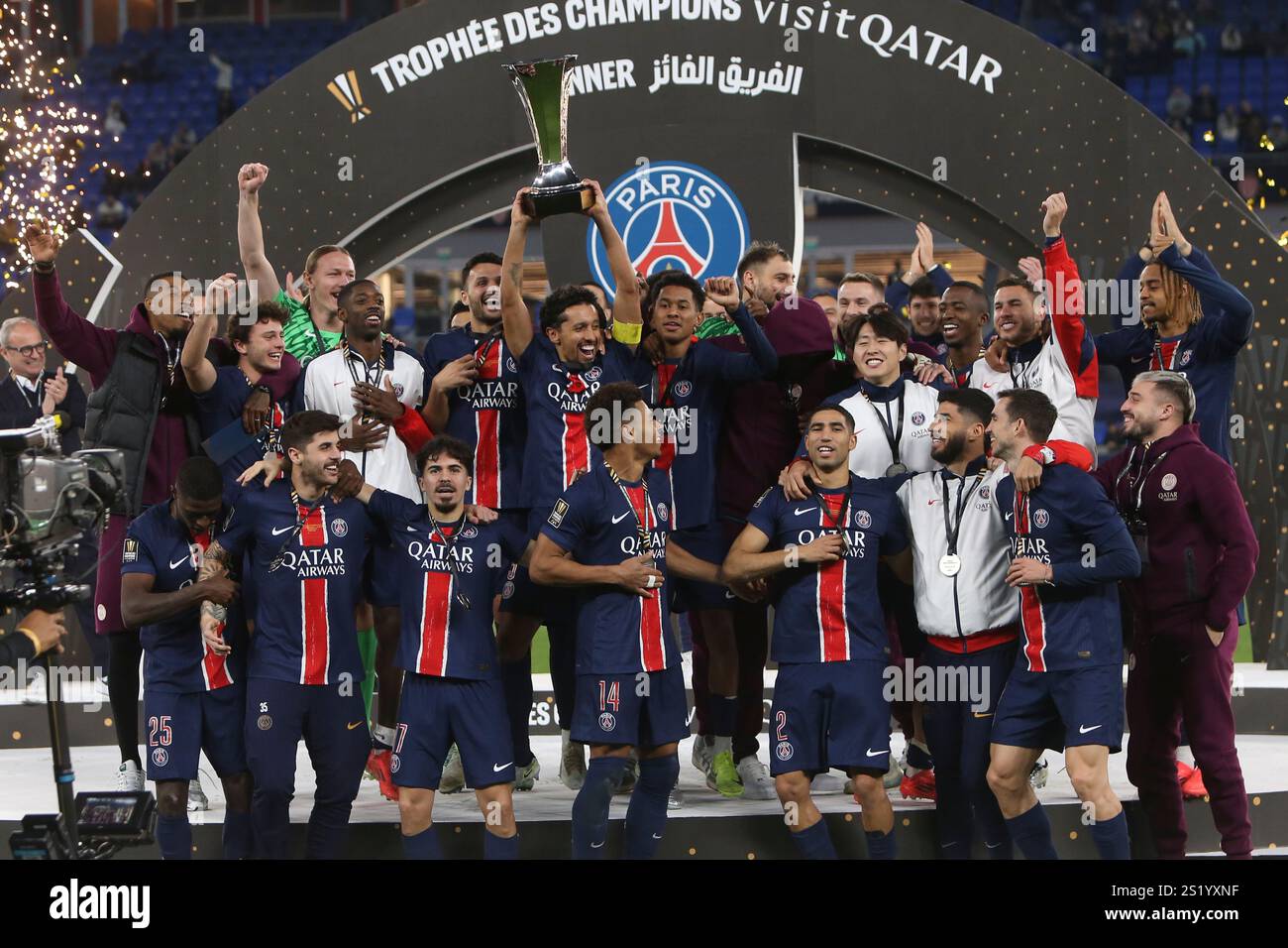 PSG players celebrate with a trophy after the French Super Cup final