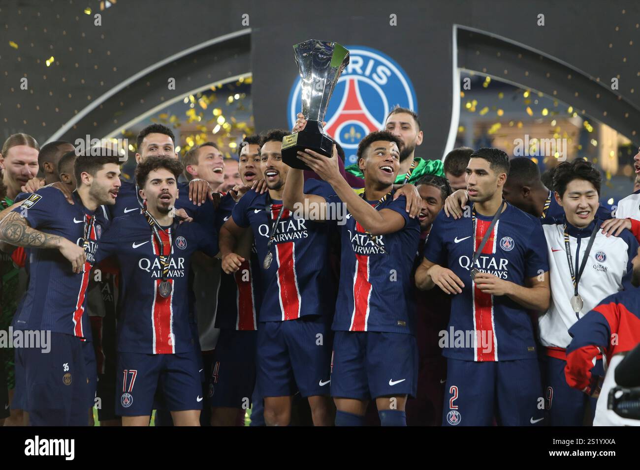 PSG players celebrate with a trophy after the French Super Cup final