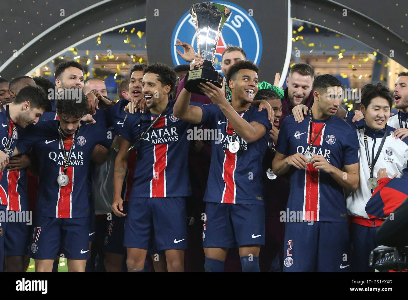 PSG players celebrate with a trophy after the French Super Cup final