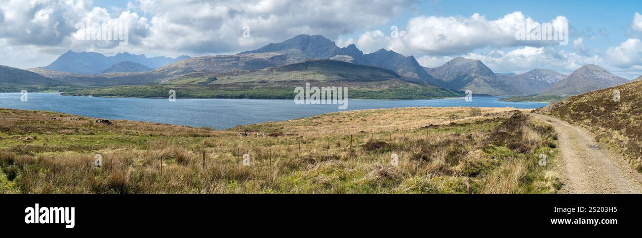 Panoramic view of the Cuillin mountain range on the Isle of Skye with Loch Slapin in the foreground, taken on the track from Suisnish, Scotland, UK. Stock Photo