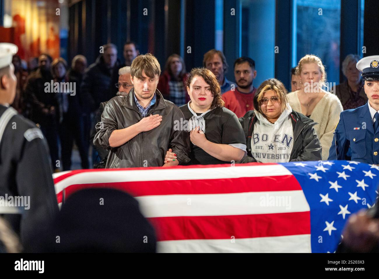 Mourners view the casket of former President Jimmy Carter as he lies in