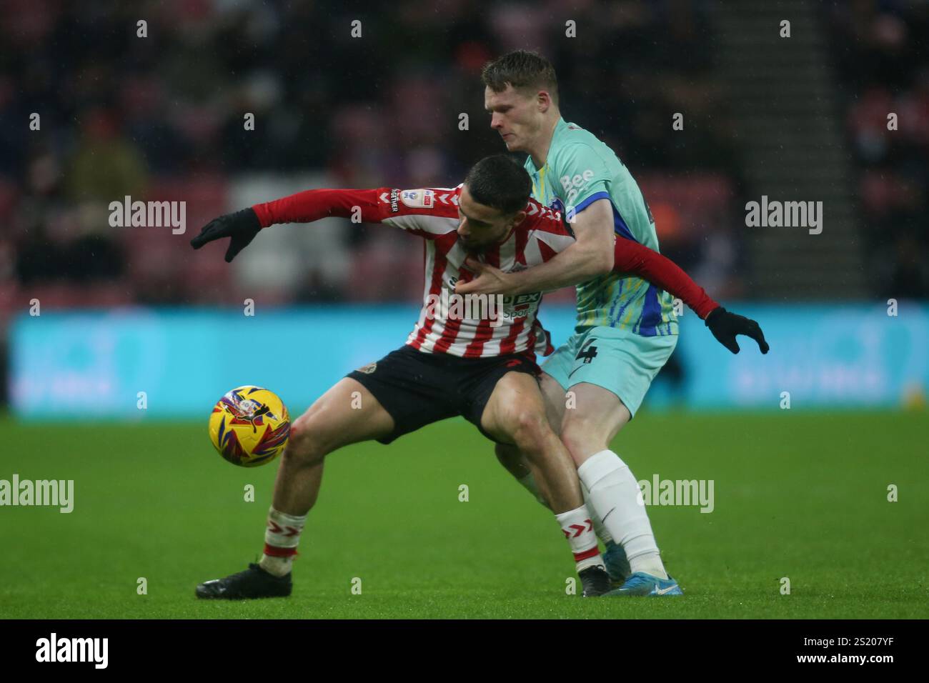 Stadium Of Light, Sunderland on Sunday 5th January 2025. Sunderland's Adil Aouchiche under pressure from Portsmouth's Terry Devlin during the Sky Bet Championship match between Sunderland and Portsmouth at the Stadium Of Light, Sunderland on Sunday 5th January 2025. (Photo: Michael Driver | MI News) Credit: MI News & Sport /Alamy Live News Stock Photo