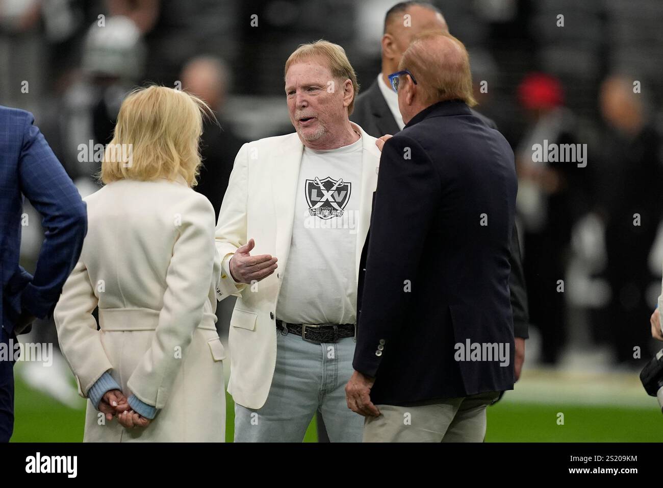 Las Vegas Raiders owner Mark Davis, middle, before an NFL football game