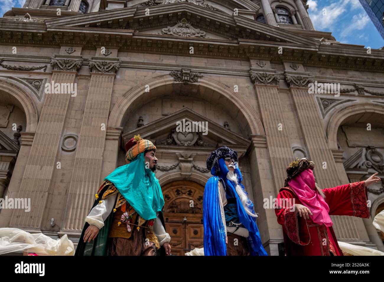 Actors representing the Three Wise Men participate in an event