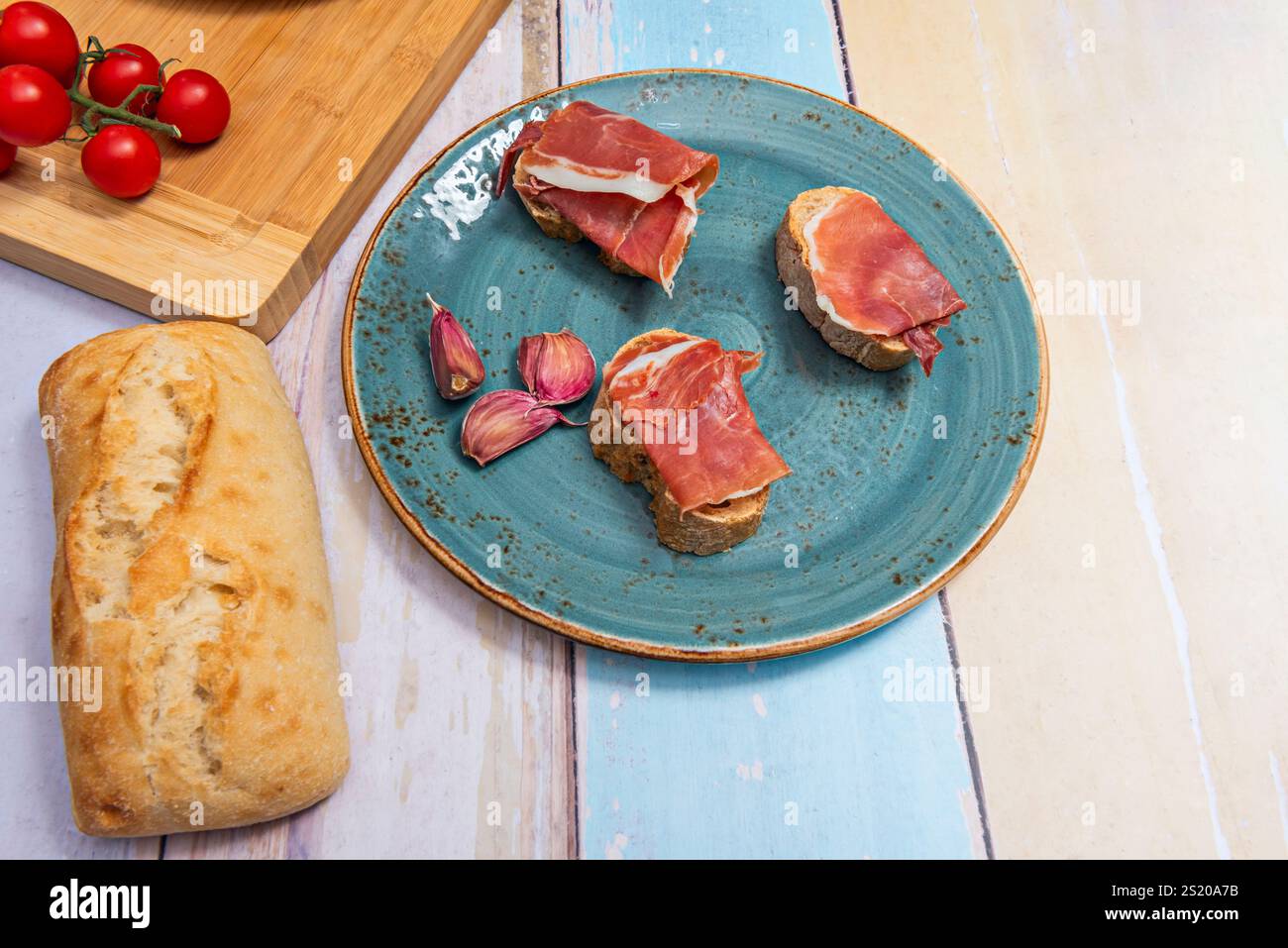 The technique of curing and drying ham to preserve it for long periods of time was known to the Romans Stock Photo