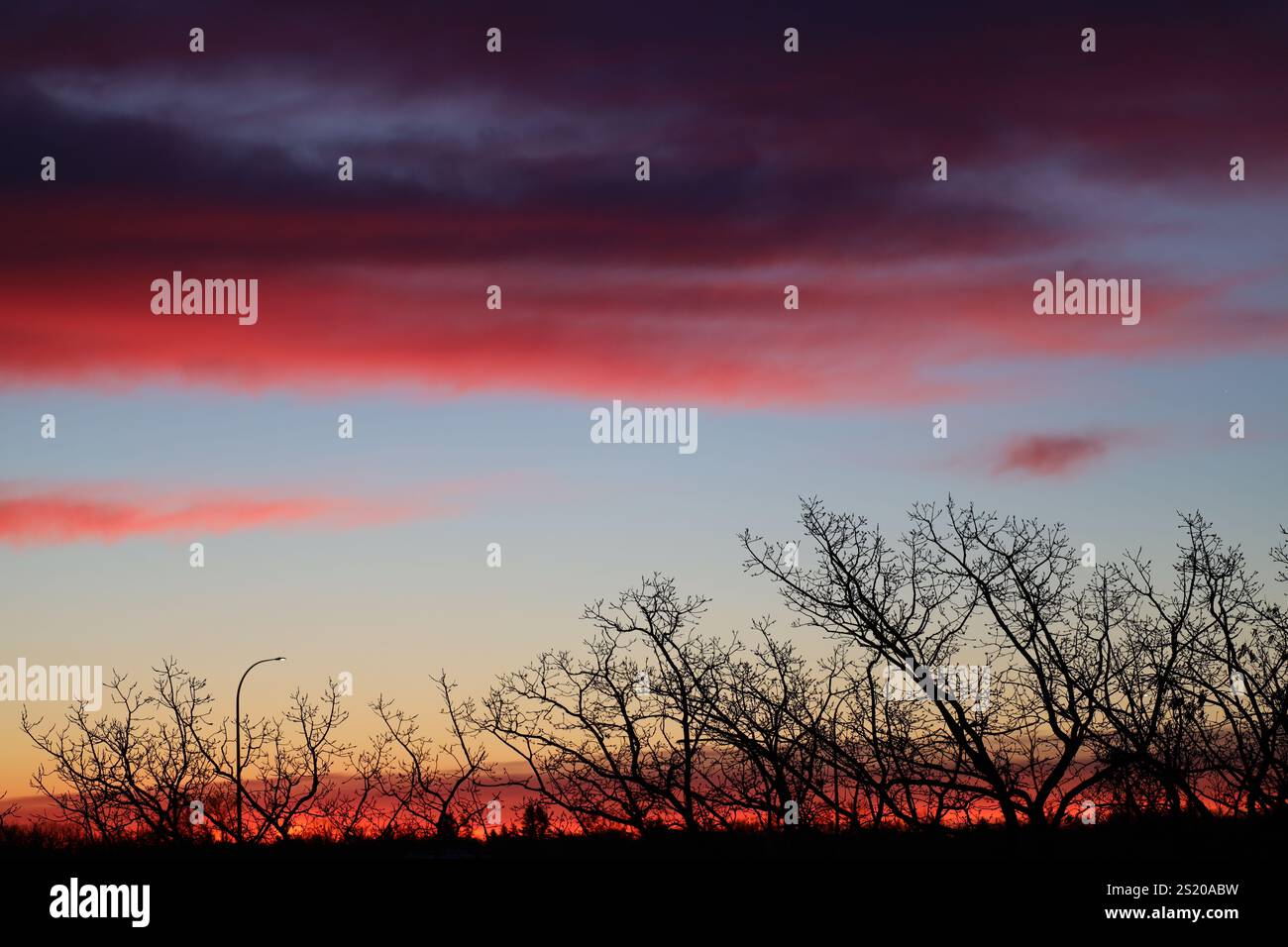 red sky at morning with dark clouds above Stock Photo - Alamy