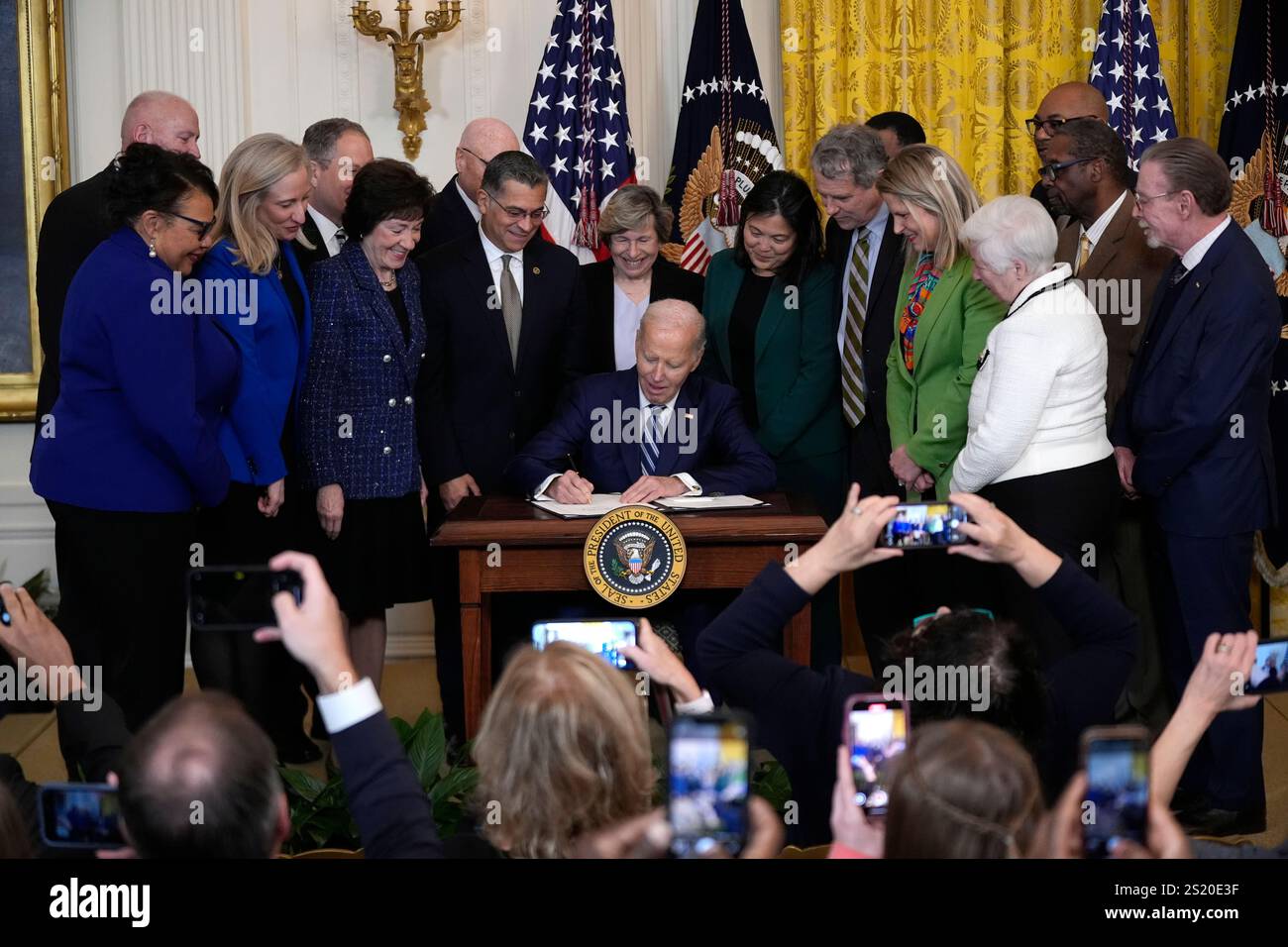 President Joe Biden signs the Social Security Fairness Act during a ceremony in the East Room of