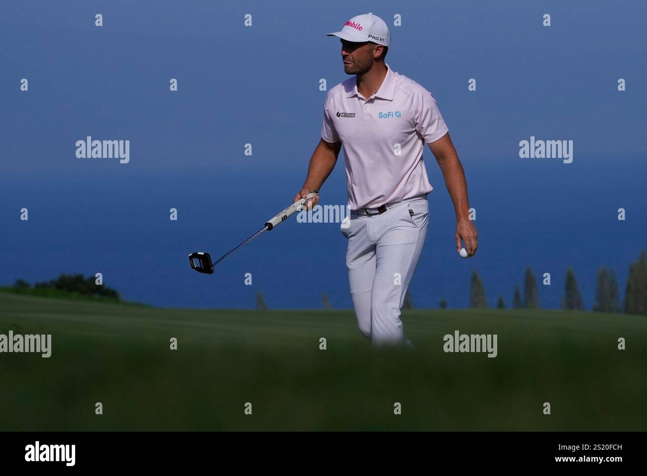 Wyndham Clark looks towards the gallery after making his shot on the