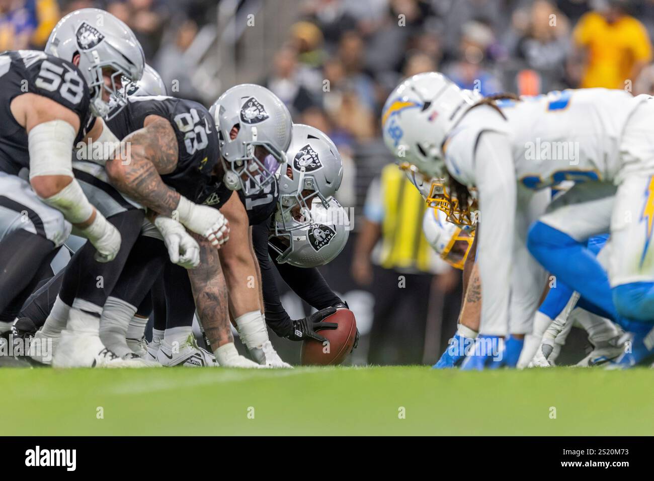 The Las Vegas Raiders line up against the Los Angeles Chargers in an