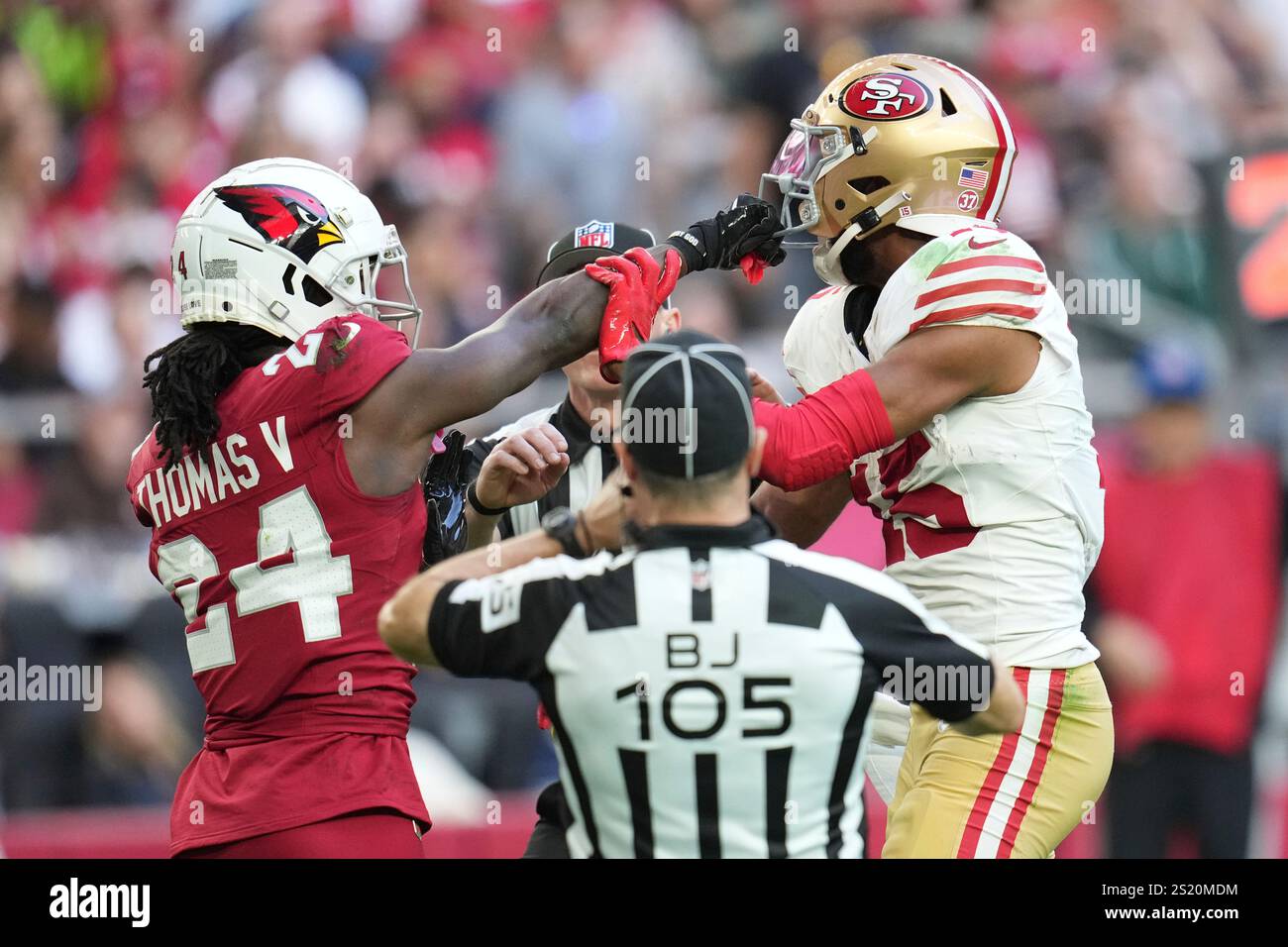 Arizona Cardinals cornerback Starling Thomas V (24) grabs the face mask ...