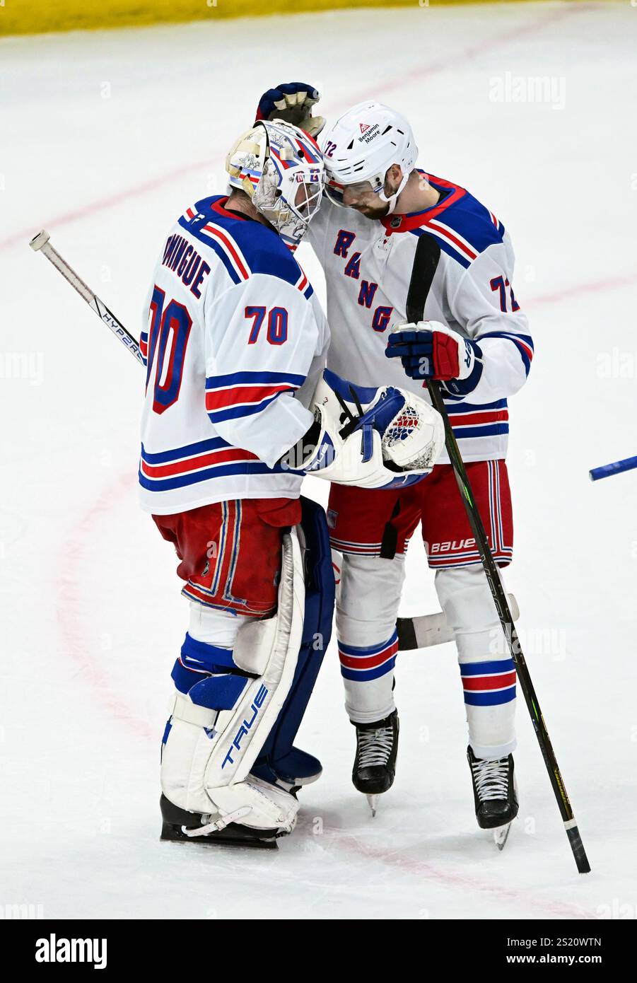 New York Rangers goalie Louis Domingue (70) celebrates with teammate ...