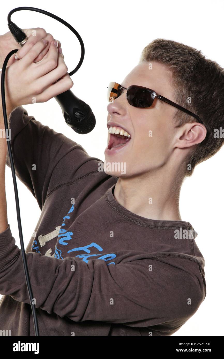 A young singer with a microphone during a performance Austria Stock ...