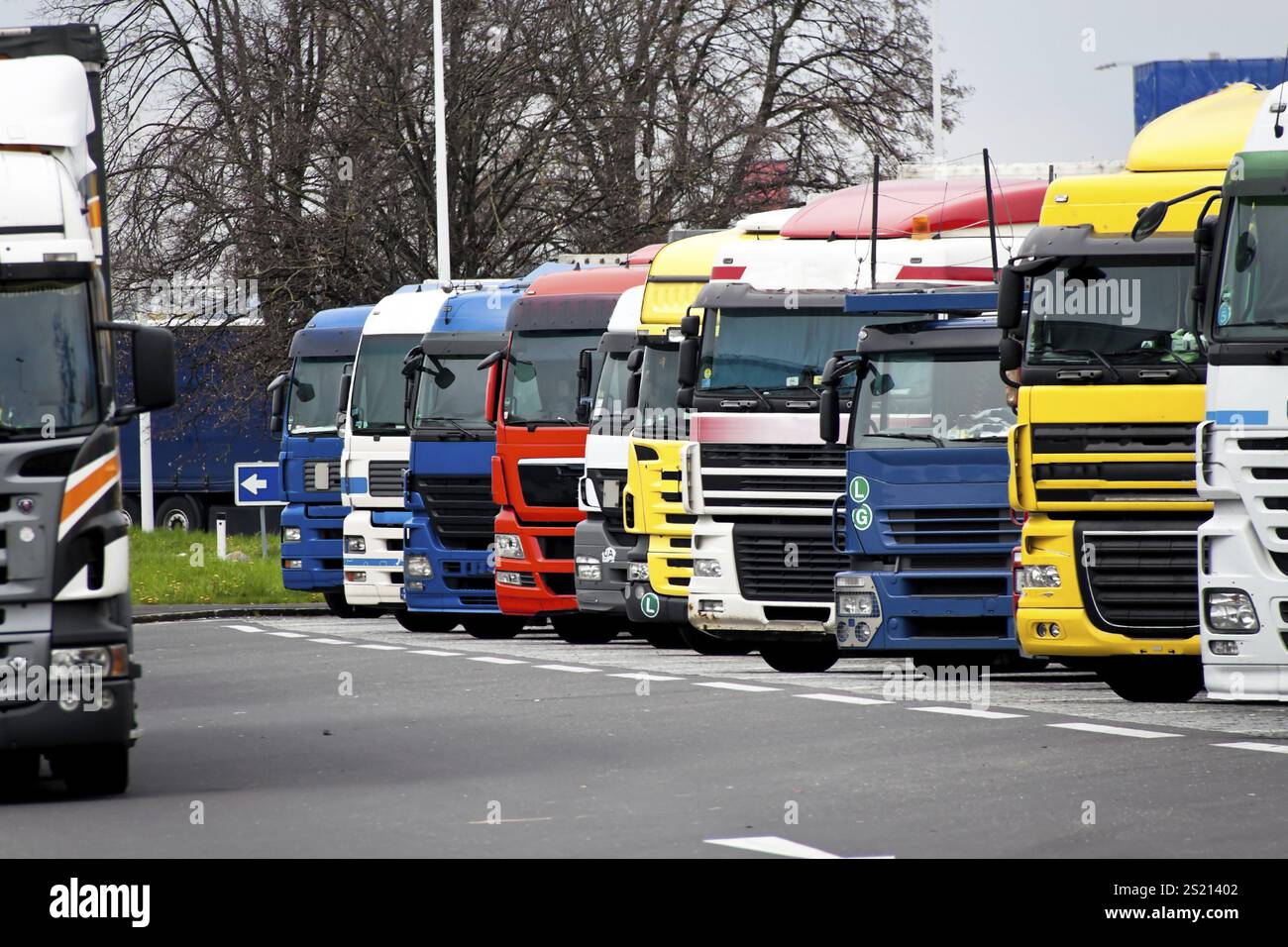 Many lorries are parked in a car park. Lorry ban Austria Stock Photo ...