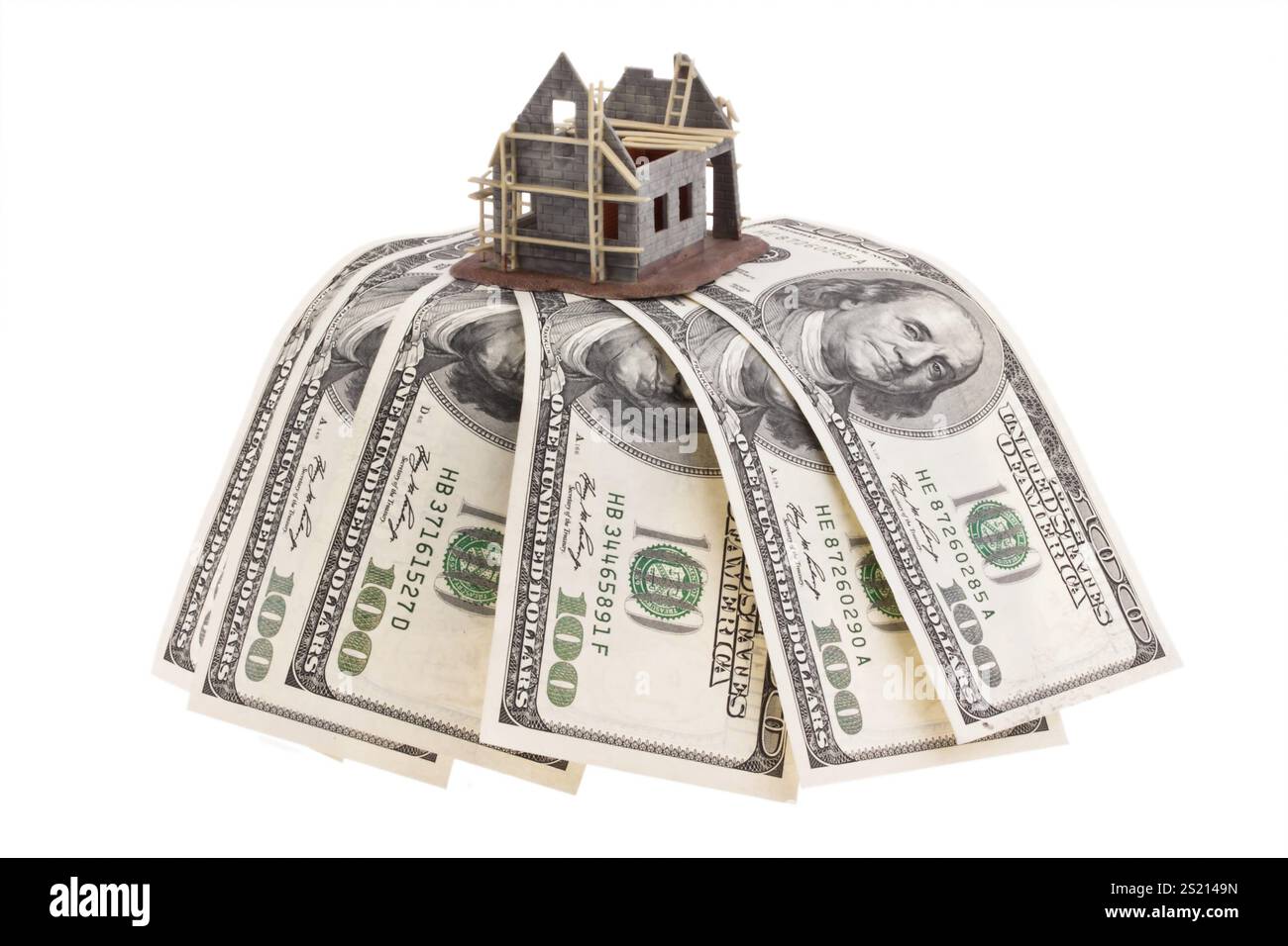 Many dollar notes and shell house Stock Photo - Alamy