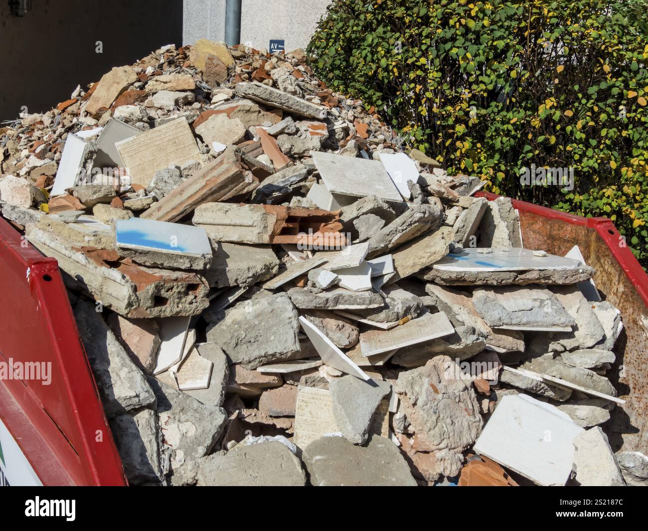 Construction waste from the demolition of a residential building in a container Austria Stock Photo