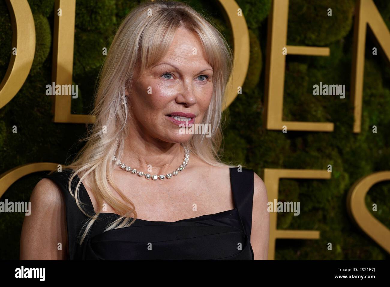 Pamela Anderson arrives at the 82nd Golden Globes on Sunday, Jan. 5