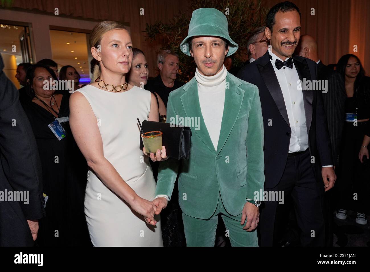 Emma Wall, left, and Jeremy Strong arrive at the 82nd Golden Globes on