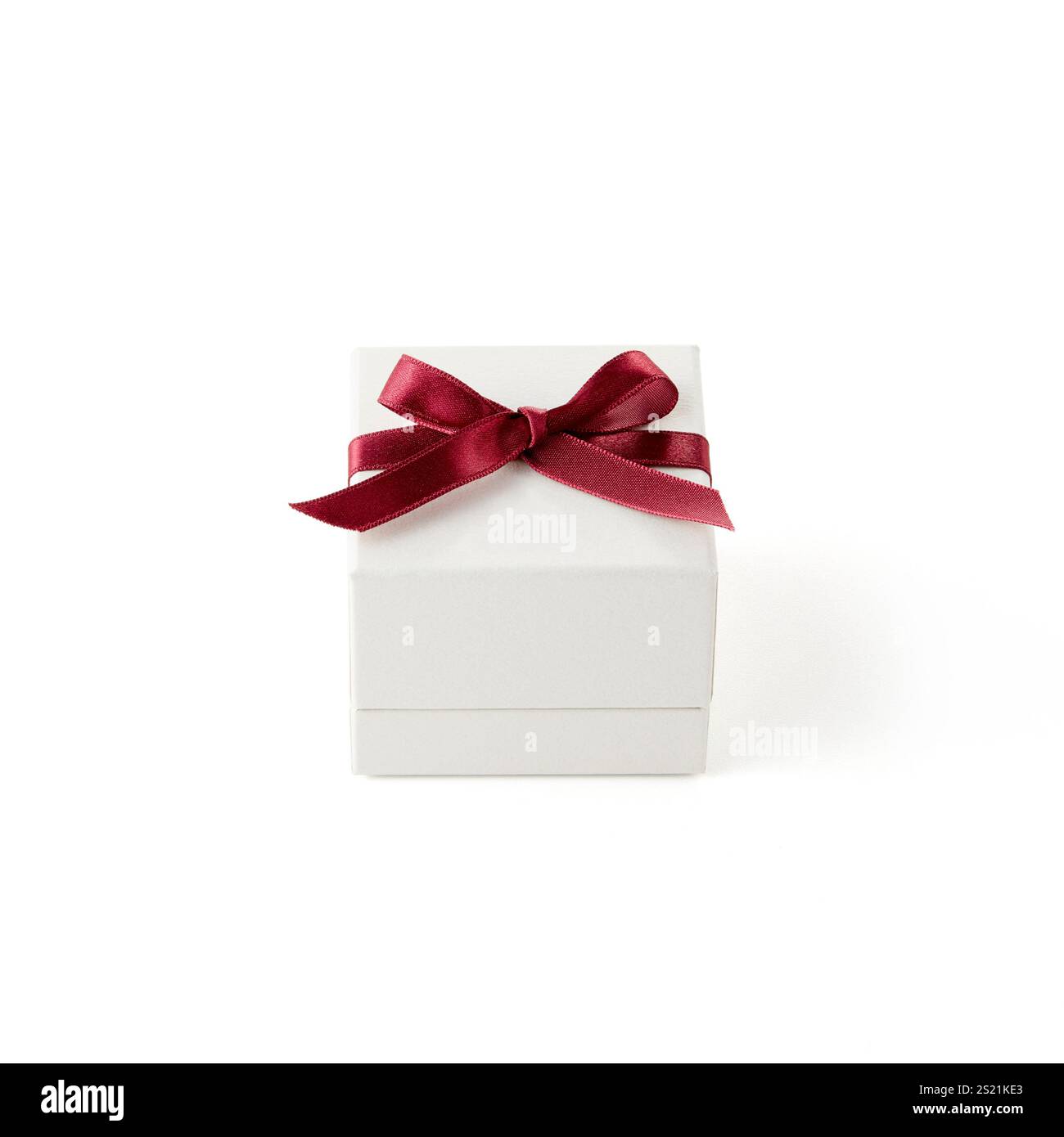 White box with red ribbon Stock Photo - Alamy