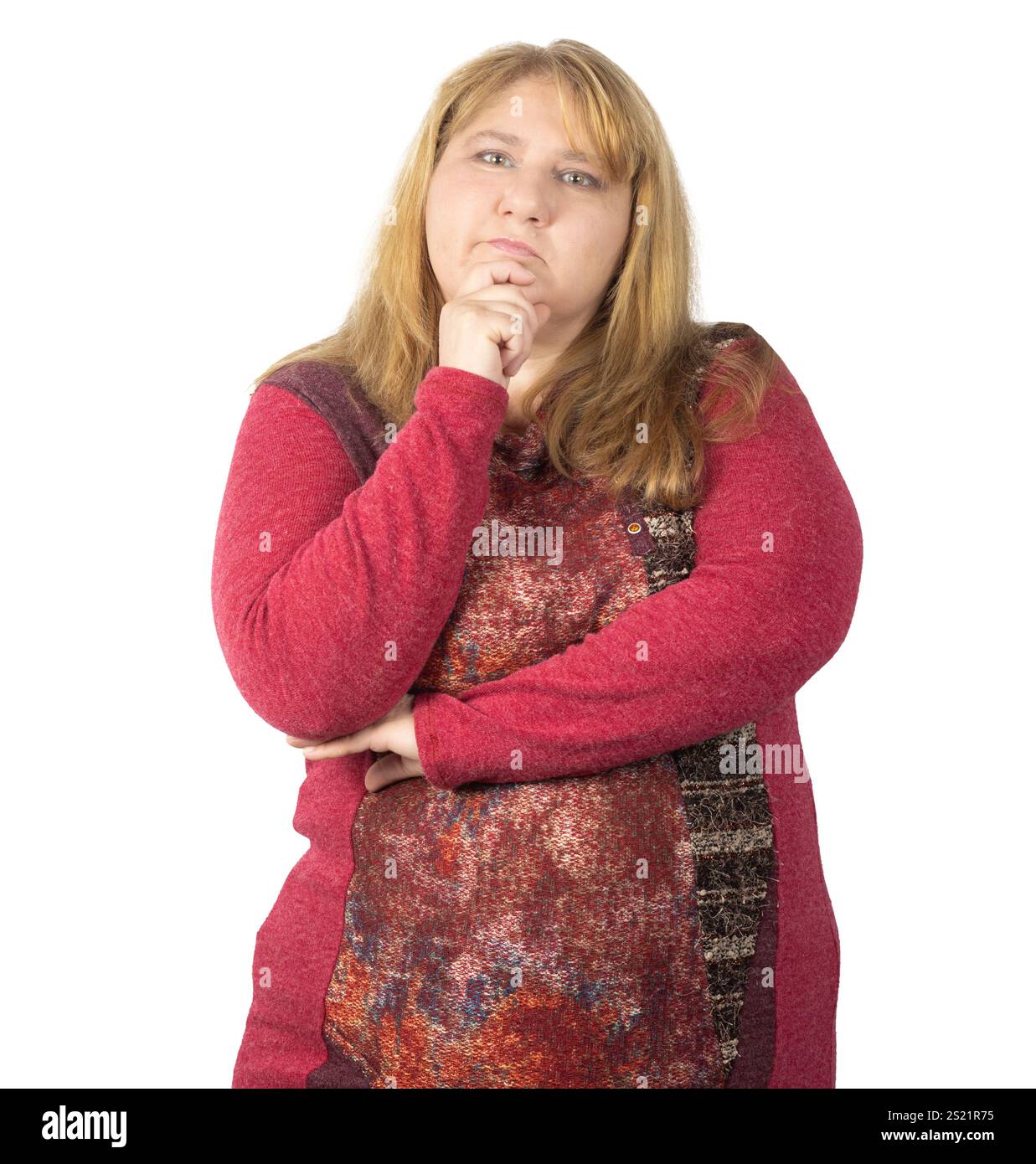 A woman with long blonde hair poses thoughtfully with her hand on her ...