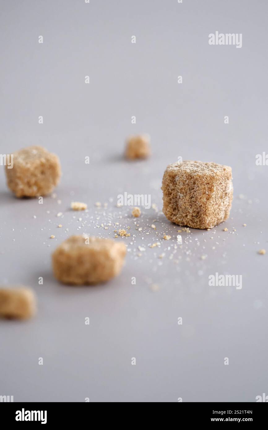 Brown sugar cubes on table Stock Photo