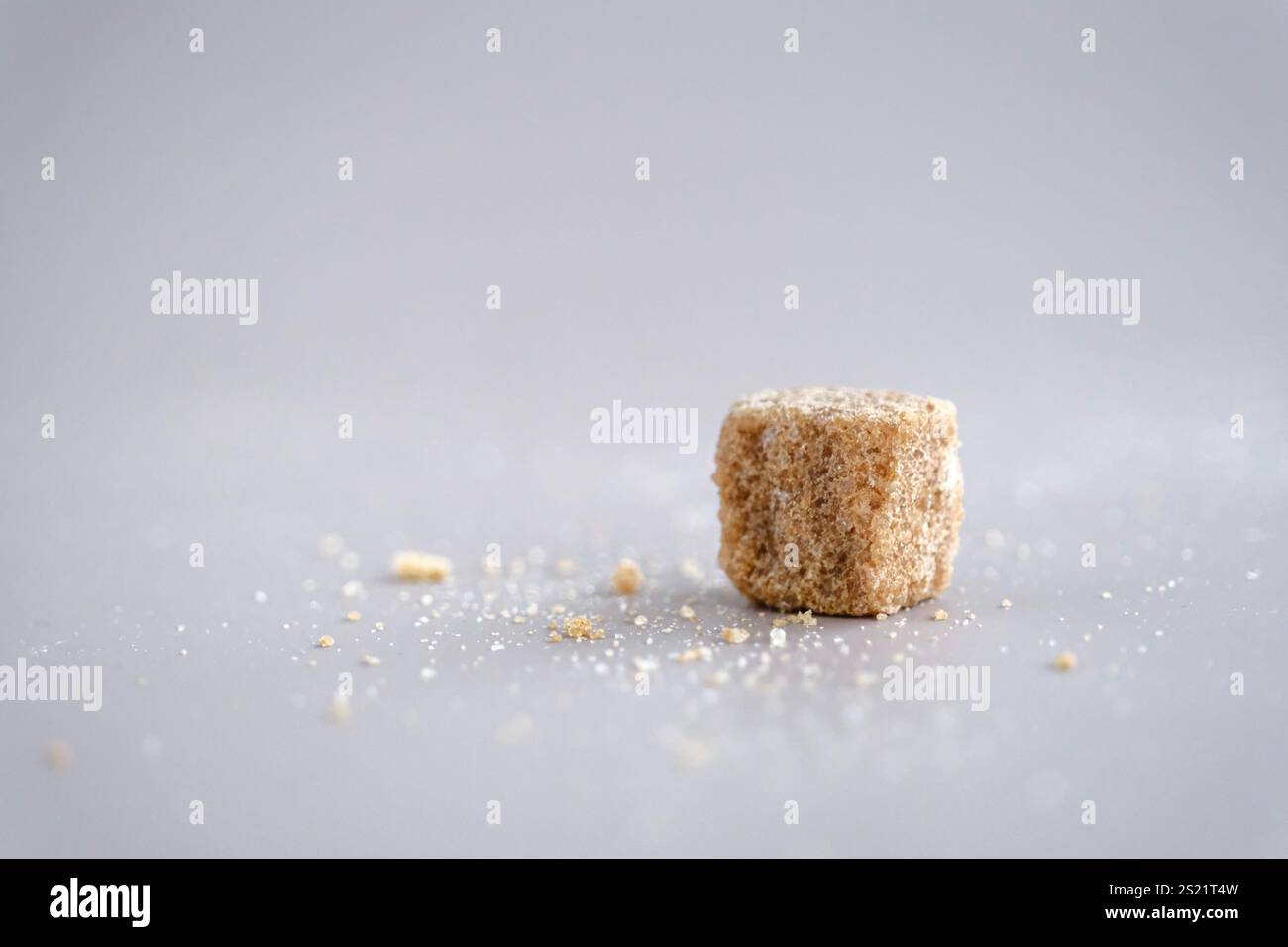 Brown sugar cubes on table Stock Photo