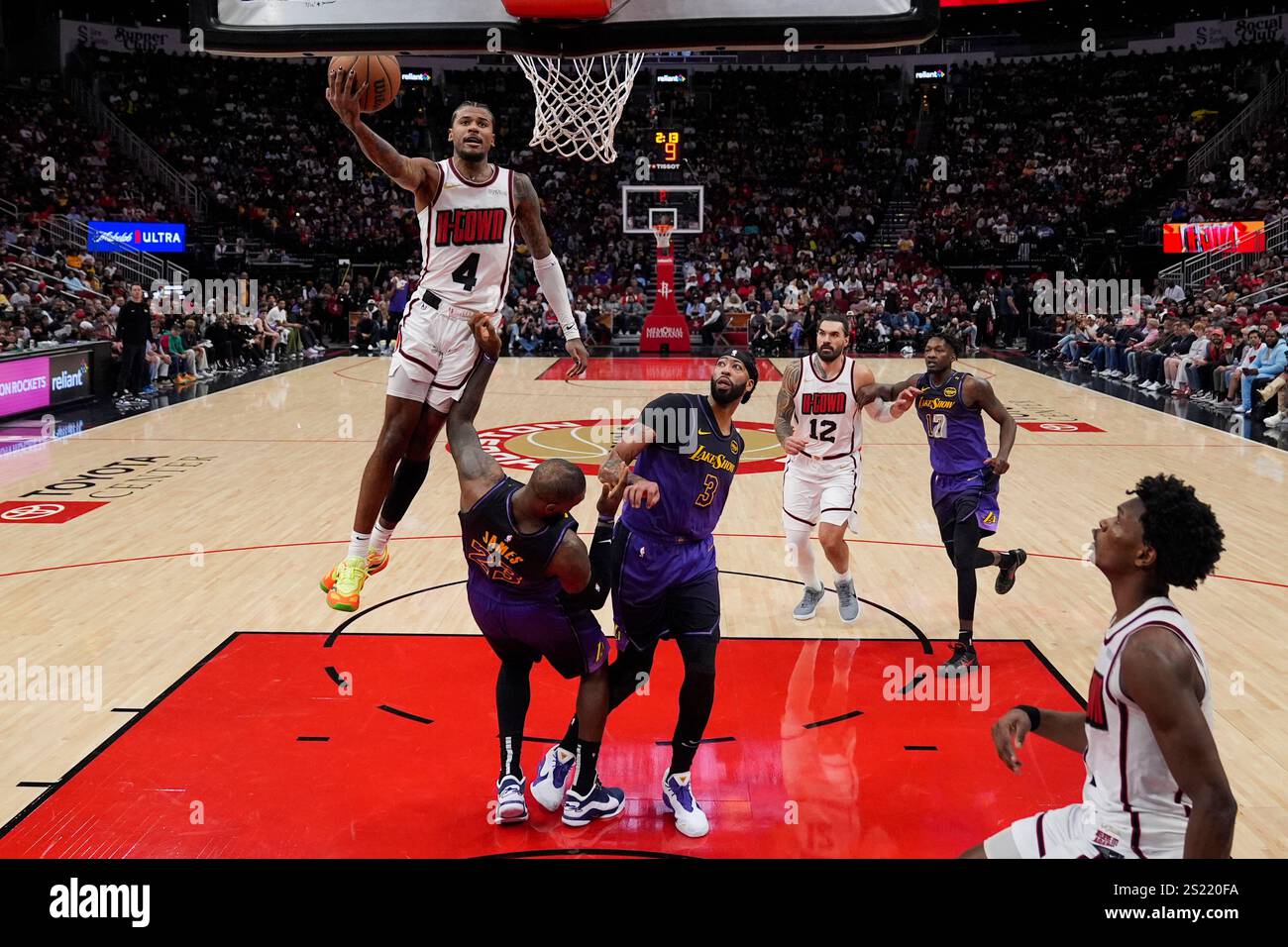 Houston Rockets guard Jalen Green (4) dunks over Los Angeles Lakers ...