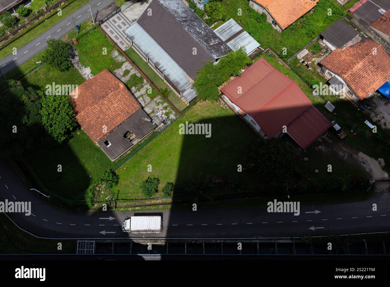 Aerial top down view of a truck on road and private properties at Tebrau district, Johor Bahru, Malaysia Stock Photo
