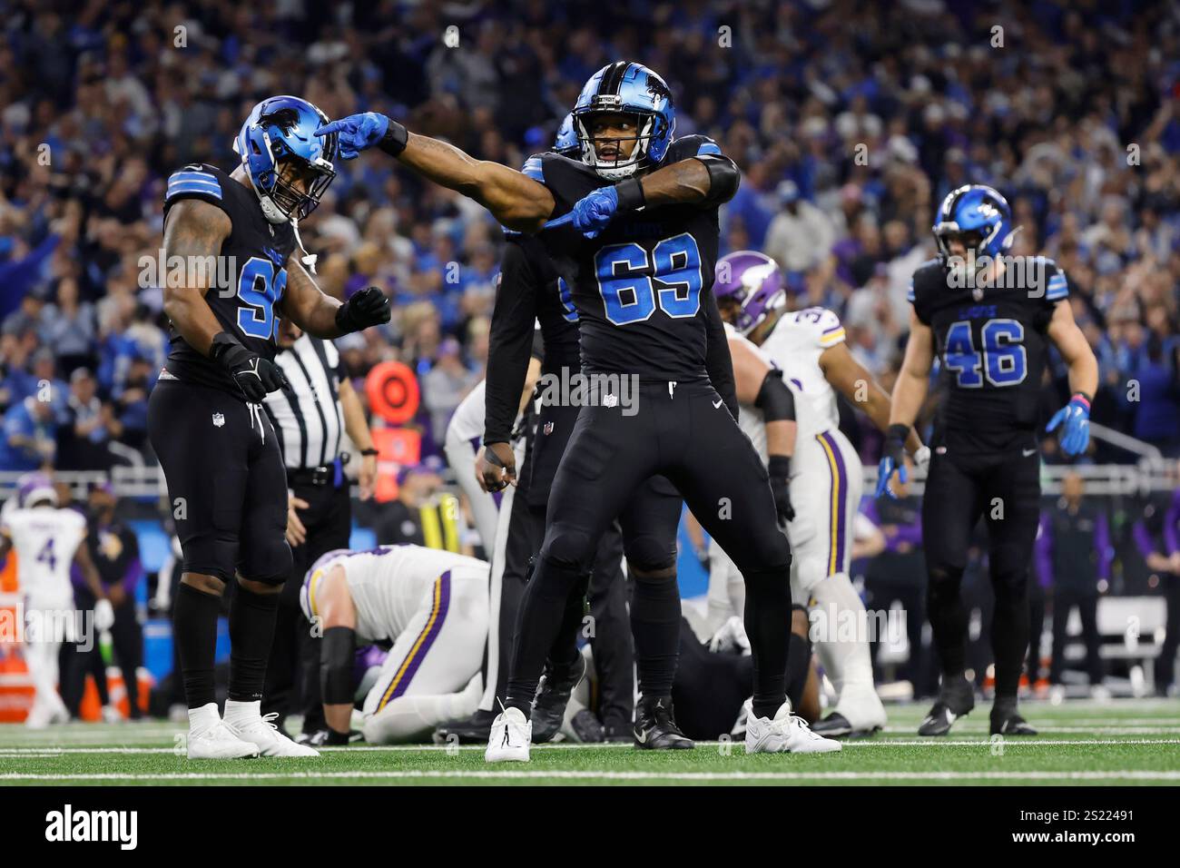 Detroit Lions linebacker AlQuadin Muhammad (69) celebrates after