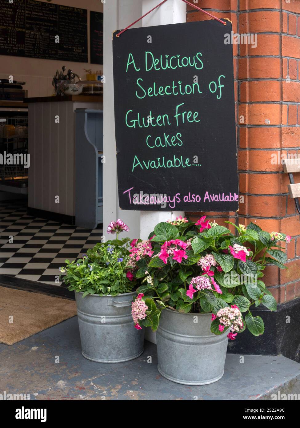 ARUNDEL, WEST SUSSEX, UK - AUGUST 25, 2015:  Menu Board outside pretty Cafe restaurant Stock Photo