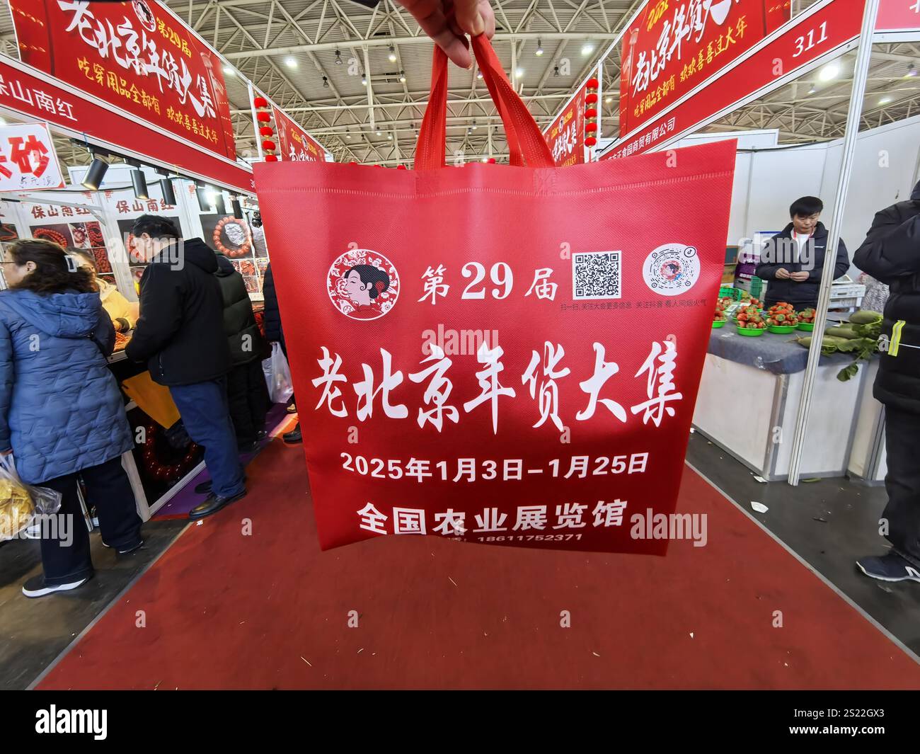 People shop Spring Festival goods in a market in Beijing, China, 3