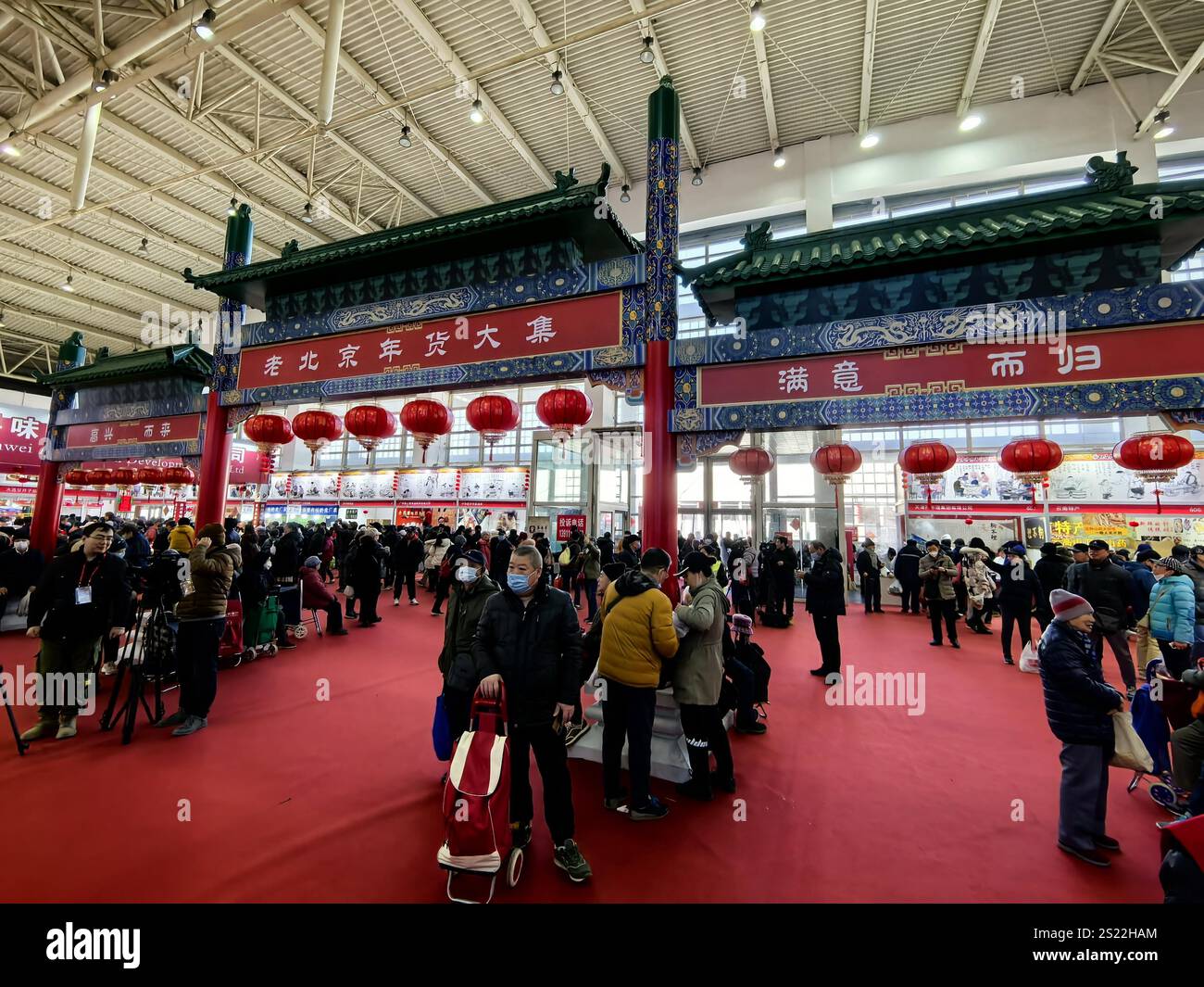 People shop Spring Festival goods in a market in Beijing, China, 3
