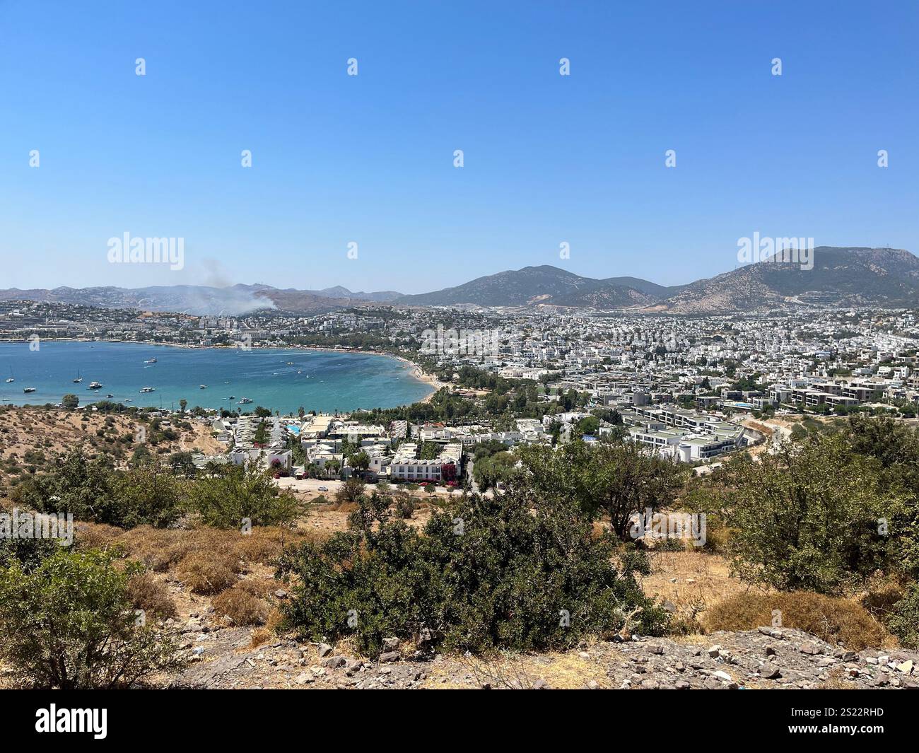 Panorama of the city Bodrum with mountains, sea and white houses. Blue sky, no clouds - Smartphone Captured Stock Image