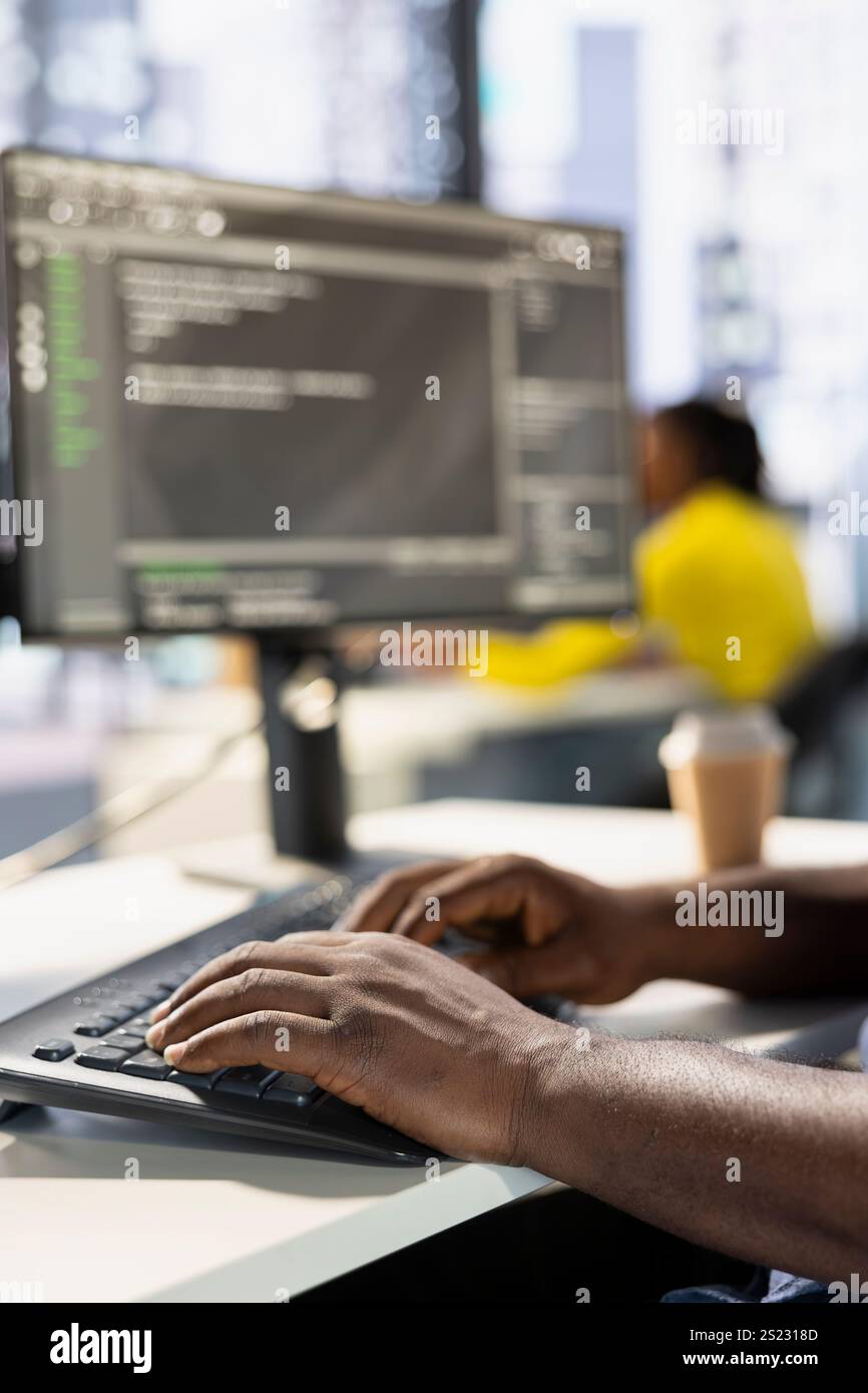 Programmer typing on keyboard, developing machine learning APIs solving complex problems. Close up of man writing code, training predictive models capable of handling complex tasks Stock Photo
