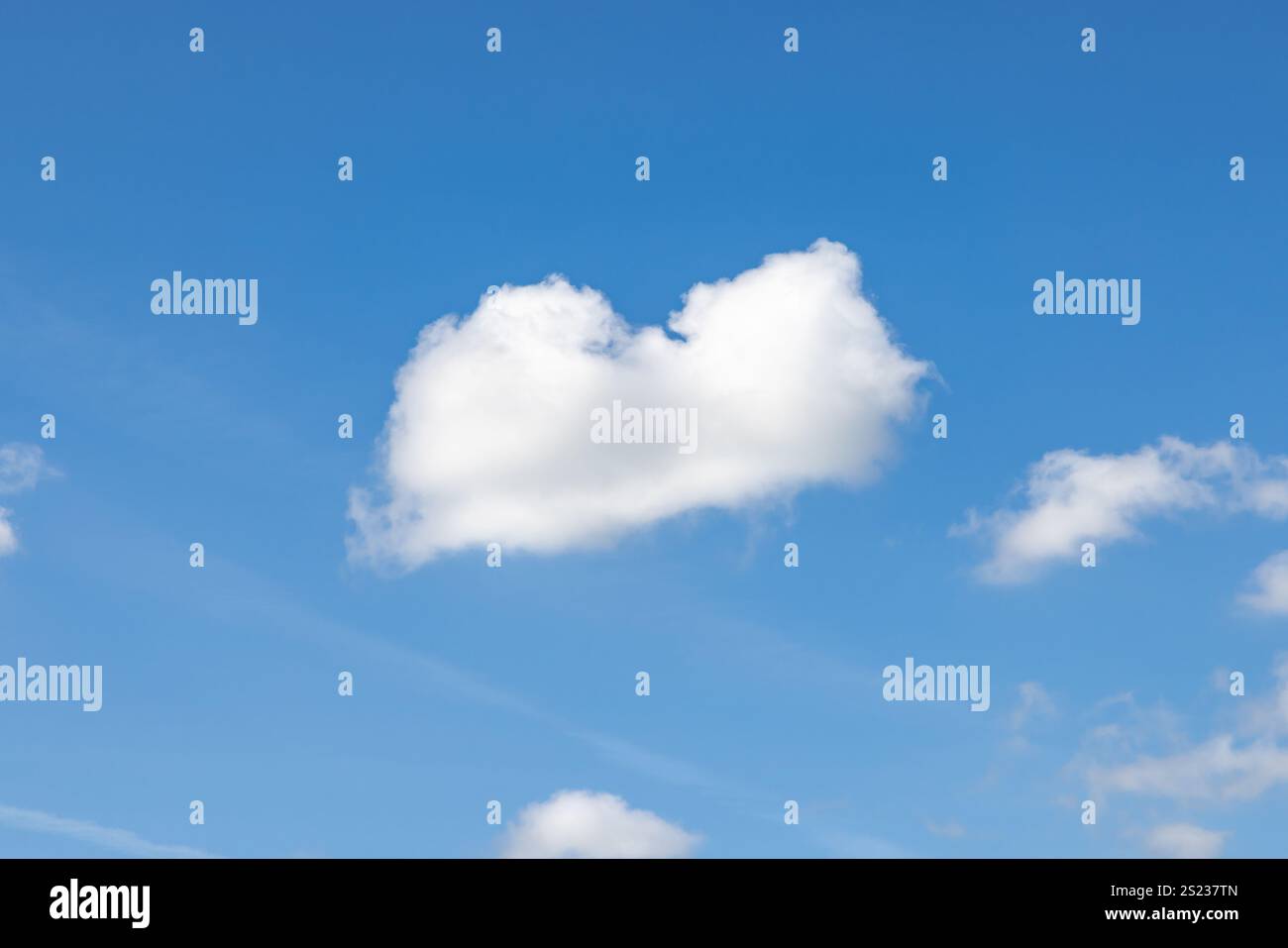 A heart shaped cloud and blue sky Stock Photo