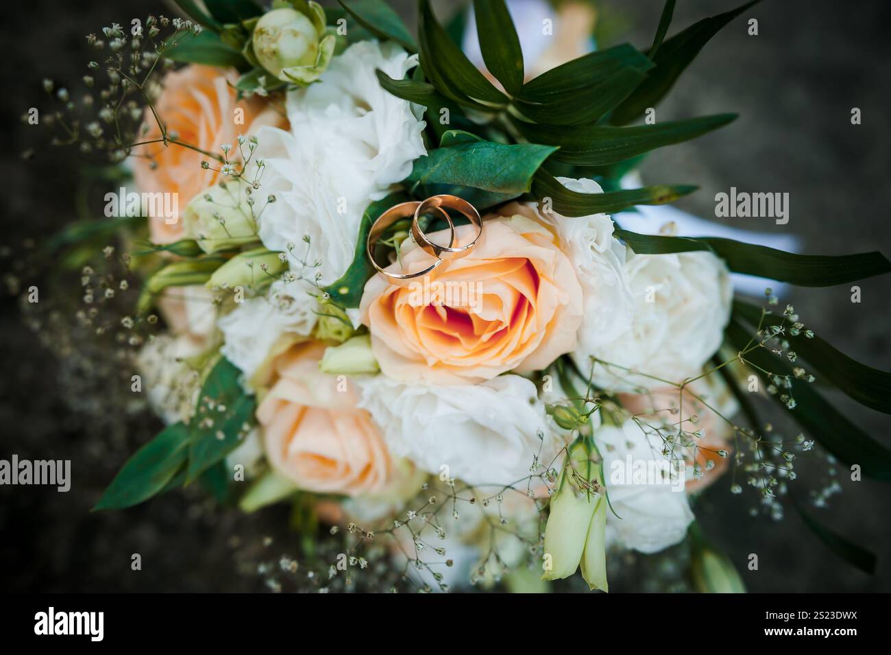 Elegant Wedding Bouquet with Rings and Soft Peach Roses Stock Photo - Alamy