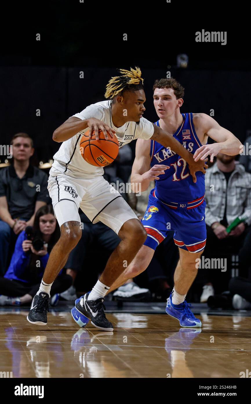 Central Florida forward JJ Taylor, left, drives against Kansas guard