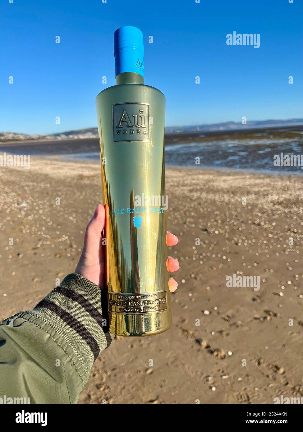 Au Vodka Blue Raspberry, with Swansea Bay in the background. The ...